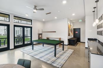 A modern living room with billiards table